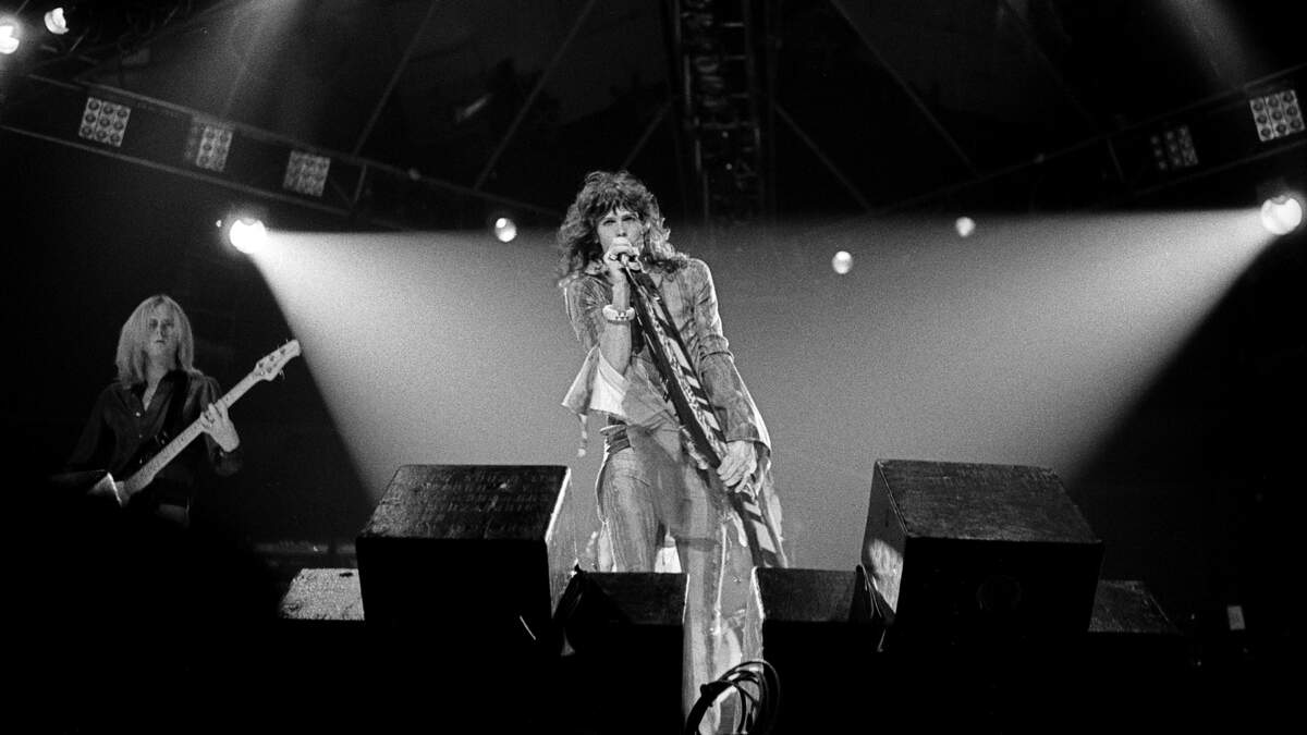Steven Tyler, Aerosmith lead singer at right, in concert at the Tarrant County Convention Center on June 21, 1977. Pictured at left is Aerosmith bassist Tom Hamilton. Steven Tyler, Aerosmith lead singer at right, in concert at the Tarrant County Convention Center on June 21, 1977. Pictured at left is Aerosmith bassist Tom Hamilton.