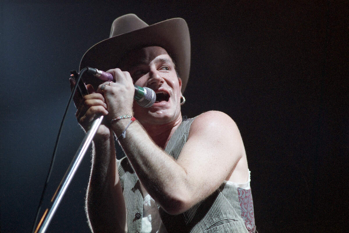 Bono, lead singer of U2, seen performing in a cowboy hat at the Tarrant County Convention Center on Nov. 23, 1987, in Fort Worth.