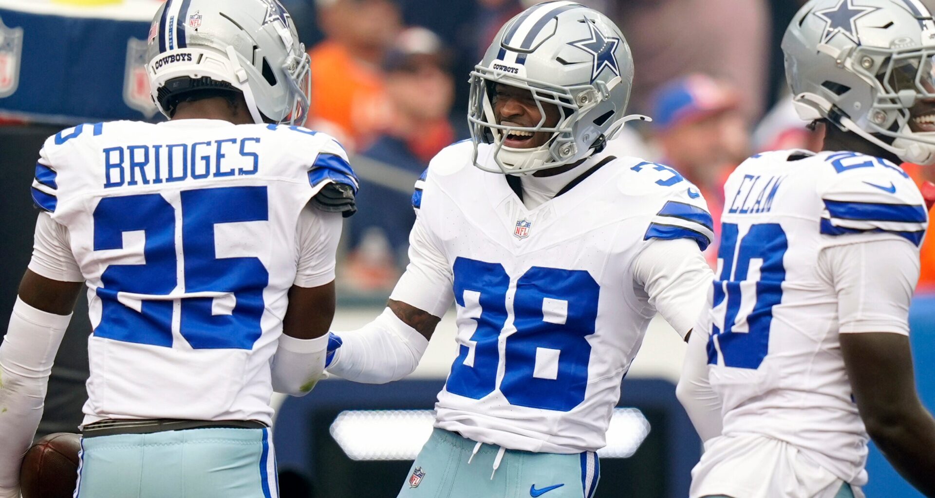 Oct 26, 2025; Denver, Colorado, USA; Dallas Cowboys safety Alijah Clark (38) and cornerback Trikweze Bridges (25) react in the first quarter against the Denver Broncos at Empower Field at Mile High.