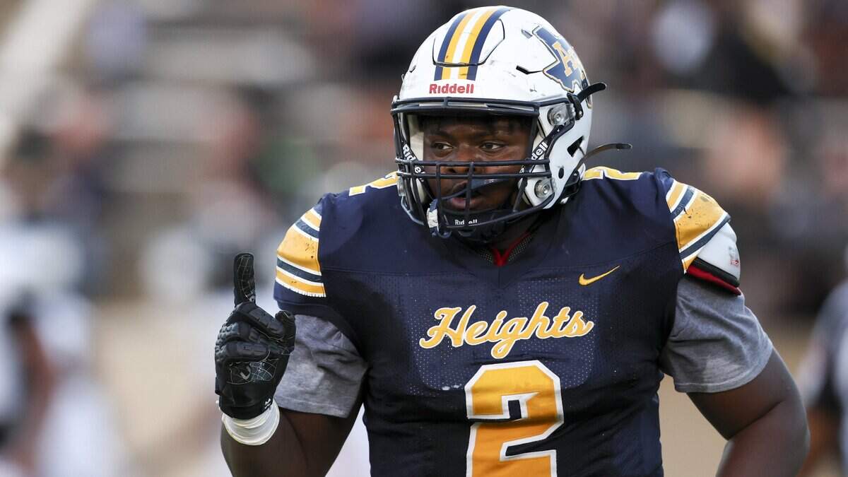 Arlington Heights defensive tackle Carter James (2) celebrates after the play against Cleburne on Thursday, Sept. 3, 2026 at Farrington Field in Fort Worth.
