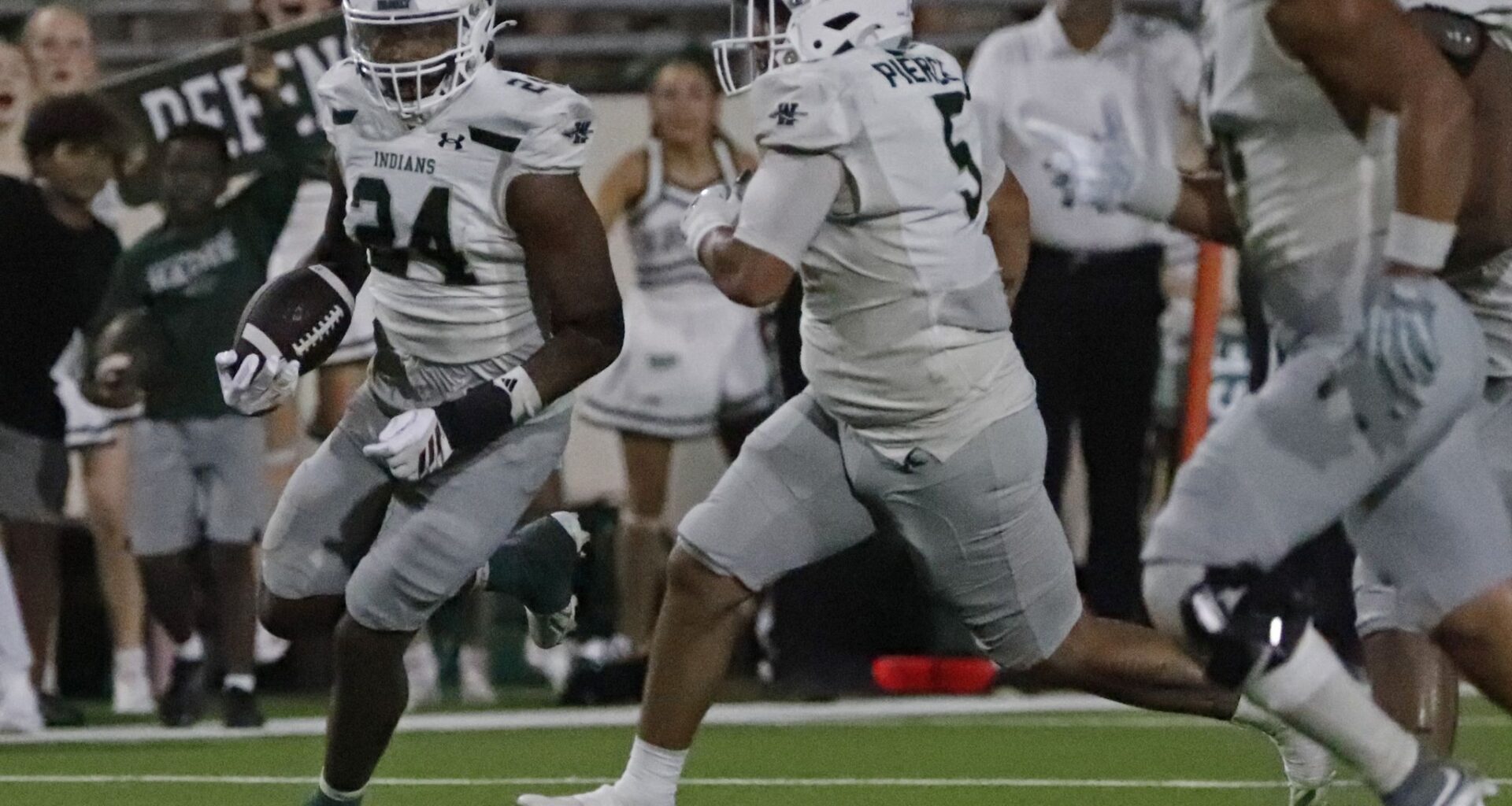 Waxahachie High School defensive end Javon Moore (24) picks up a host of blockers to escort him to the end zone and put the game well out of reach during the second half as Denton Guyer High School hosted Waxahachie High School in a nondistrict football game at the C.H. Collins Complex in Denton on Thursday, September. 10, 2026.