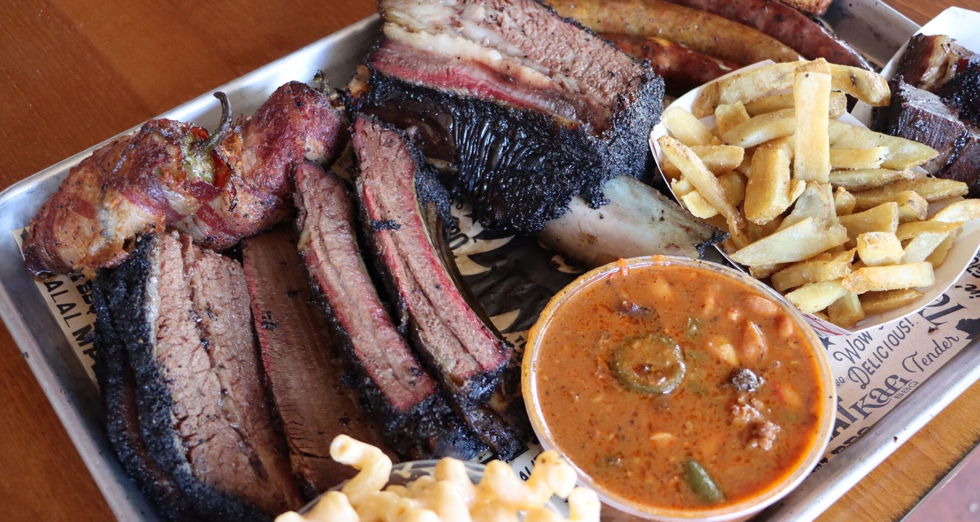 A selection from the Kafi BBQ menu, Sunday, June 28, 2026, in Irving, Texas. (Ulaa Kuziez/Religion News Service via AP)