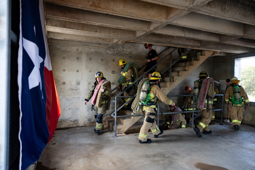 Firefighters carried more than 50 pounds of gear each, as they made the tower climb 9 times.