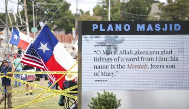 Protesters hold signs opposing Sharia law is seen from the premises of the Islamic Association of Collin County on Friday, Sept. 11, 2026, in Plano.