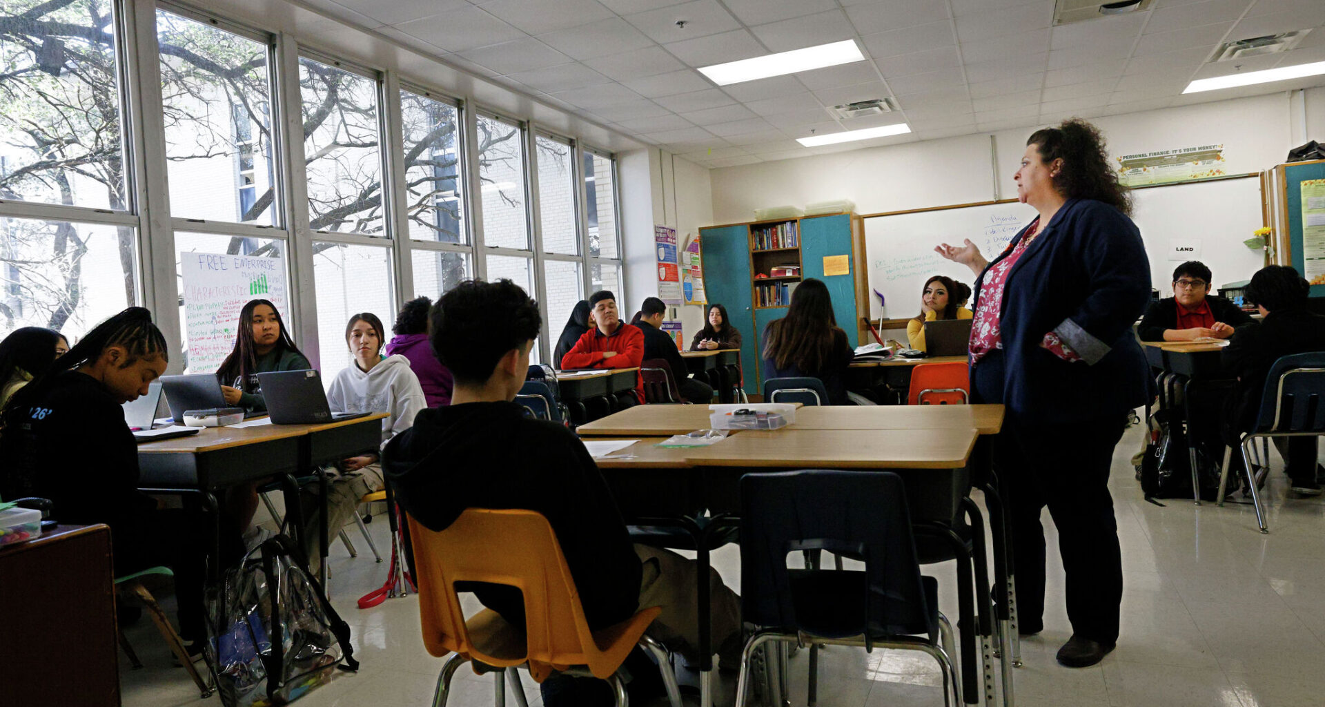 Julie Harris teaches a personal financial literacy and economics class at Skyline High School in March in Dallas.