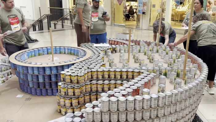 San Antonio teams build giant sculptures out of roughly 30K cans to fight hunger at North Star Mall