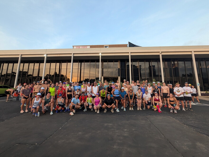 Run club poses for a group photo before the start of their run.