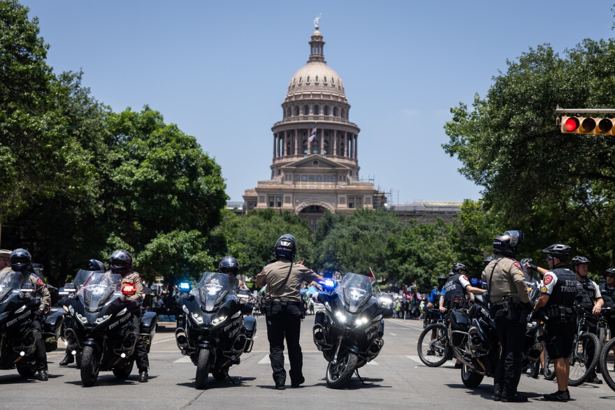 Texas DPS troopers on motorcycles line up at Congress Ave. and 10th Street in 2024.
