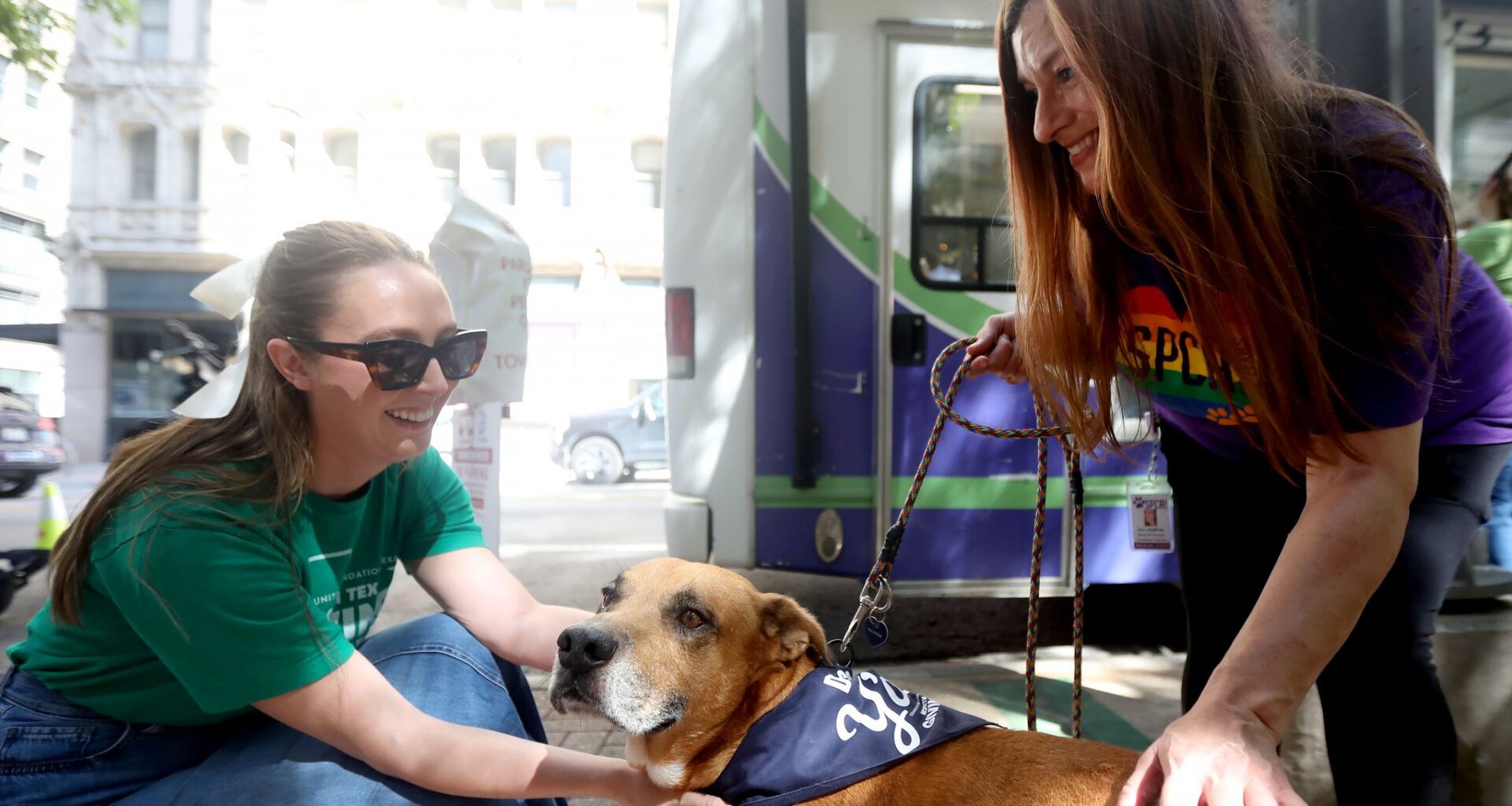 Sara Godfrey, with the SPCA, right, walks Anton, and talks to Amanda Little during the Downtown Dallas Day of Giving, a free community event celebrating North Texas Giving Day, at Pegasus Plaza in Dallas, Texas, Monday, September 14, 2026.