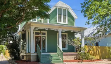 Queen Anne Victorian for sale steps from the River Walk has a sun porch and stained glass windows