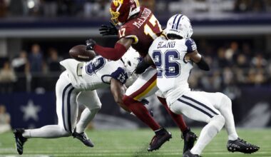 Dallas Cowboys quarterback Dak Prescott (4) celebrates with tight end Jake Ferguson (87) after they connected on a touchdown pass during the first half of an NFL football game against the Washington Commanders on Thursday, Dec. 25, 2025, in Landover, Md.