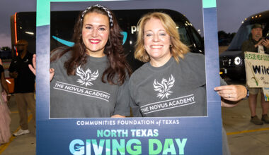 People holding sign for North Texas Giving Day.