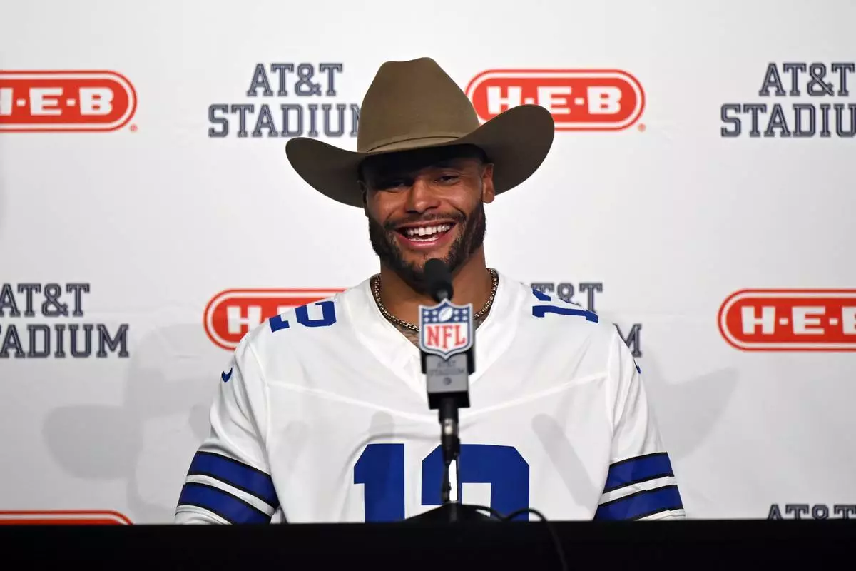 Dallas Cowboys quarterback Dak Prescott speaks in a press conference after an NFL football game against the Washington Commanders in Arlington, Texas, Sunday, Sept. 20, 2026. (AP Photo/Jessica Tobias)
