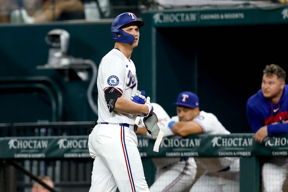 Texas Rangers pitcher Jacob Latz (left) celebrates with left fielder Wyatt Langford after the final out of a 6-2 victory over the Toronto Blue Jays in a baseball game at Globe Life Field on Saturday, Sept. 19, 2026, in Arlington.
