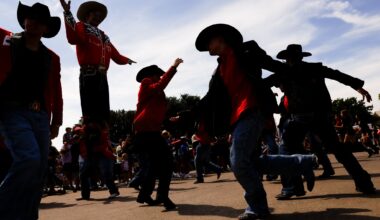 Dancers with the Top Royal Cadets perform in the parade in front of Big Tex during opening day of the State Fair of Texas at Fair Park in Dallas, Friday, Sept. 25, 2026.
