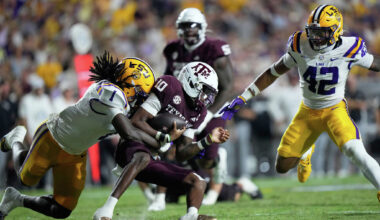 SMU quarterback Kevin Jennings (7), second from right, scores a touchdown as SMU offensive lineman Alex Woods (77) defends against Missouri State linebacker Jared Lloyd (0) during the second half of an NCAA college football game at Gerald J. Ford Stadium in University Park, Saturday, Sept. 26, 2026.