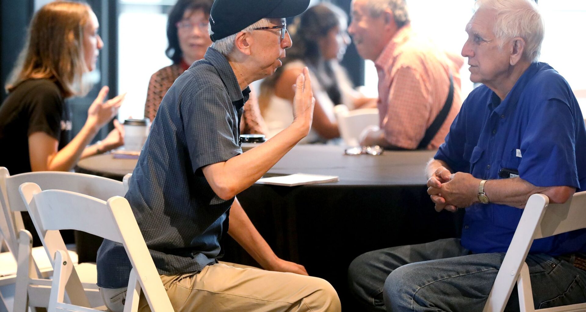Tom Huang, left, Assistant Managing Editor for Journalism Initiatives at The Dallas Morning News, speaks to Wayne Gary, during a Dallas Morning News pop-up newsroom at Urban Rio in downtown Plano, Texas, Monday, September 28, 2026.