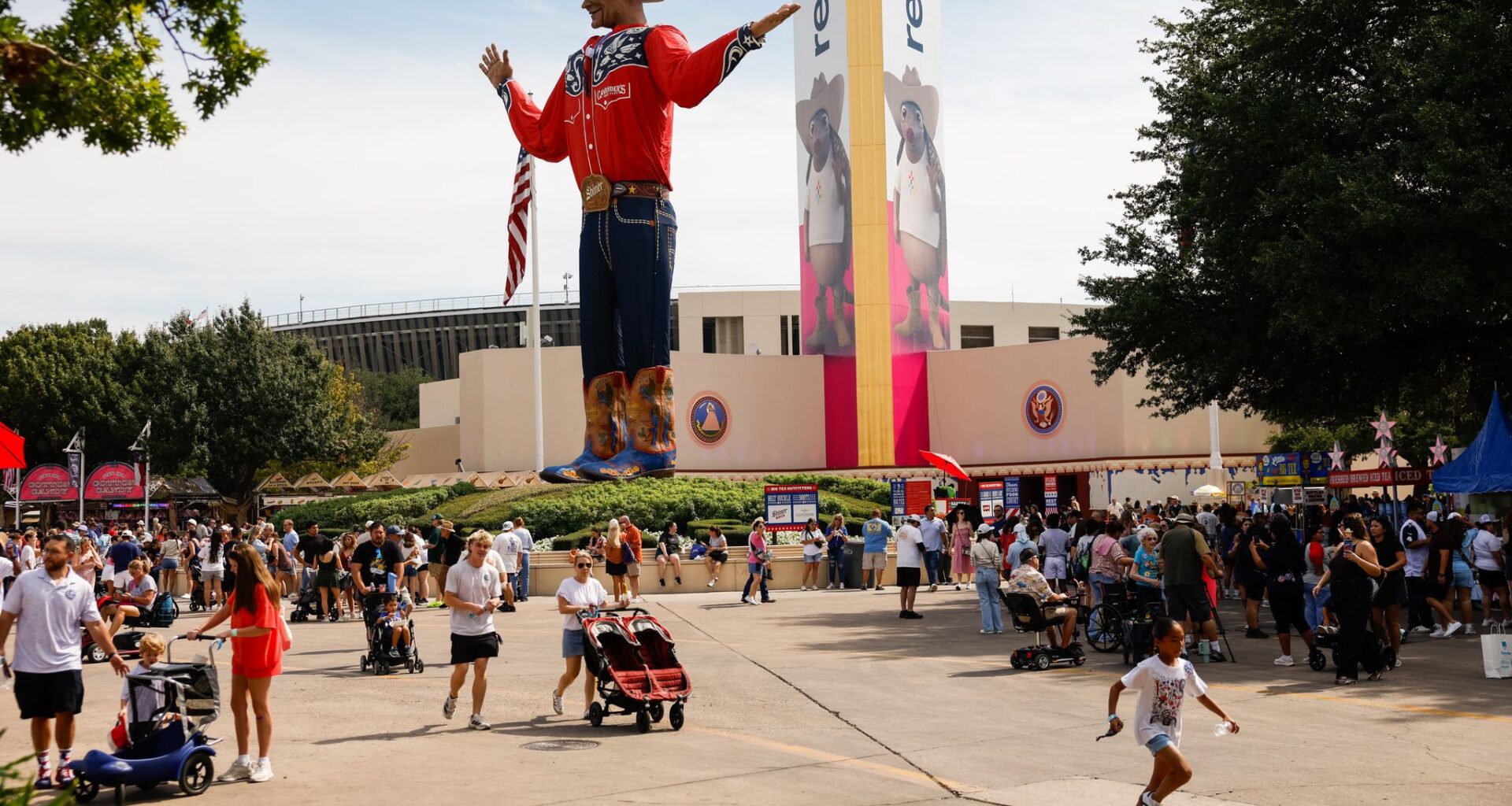 People near Big Tex during opening day of the State Fair of Texas at Fair Park in Dallas, Friday, Sept. 25, 2026.