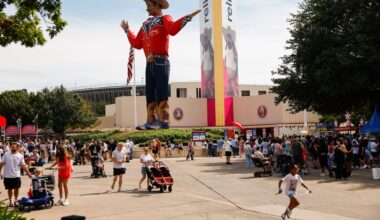 People near Big Tex during opening day of the State Fair of Texas at Fair Park in Dallas, Friday, Sept. 25, 2026.