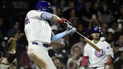 Sep 16, 2026; Chicago, Illinois, USA; Chicago Cubs center fielder Pete Crow-Armstrong (4) hits a home run during the third inning against the Atlanta Braves at Wrigley Field.