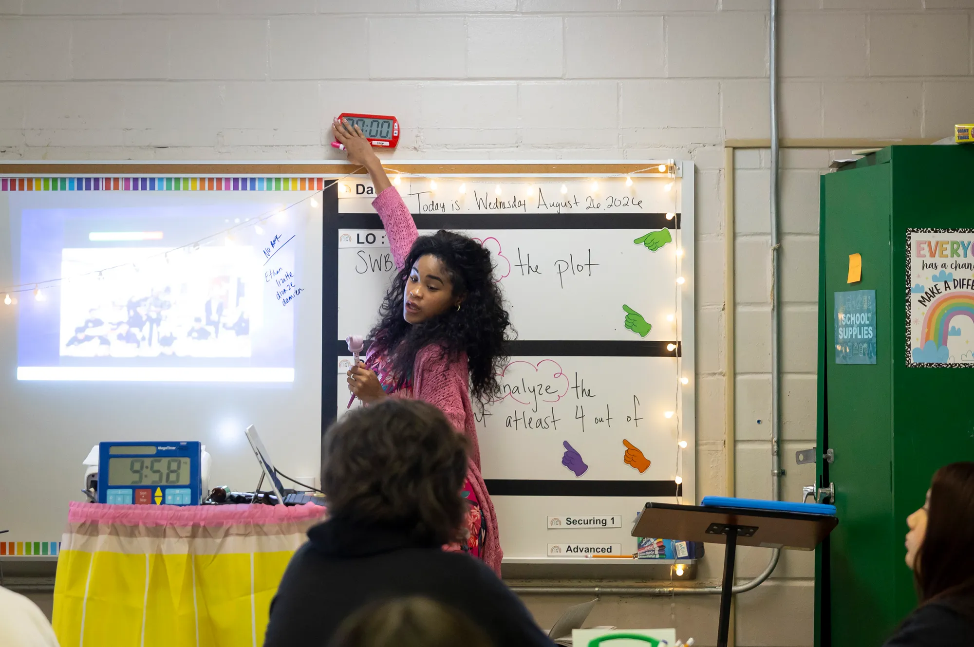 Eighth grade ELA teacher Shannon Cooper turns off a timer alarm after an instructional period at Fonville Middle School.