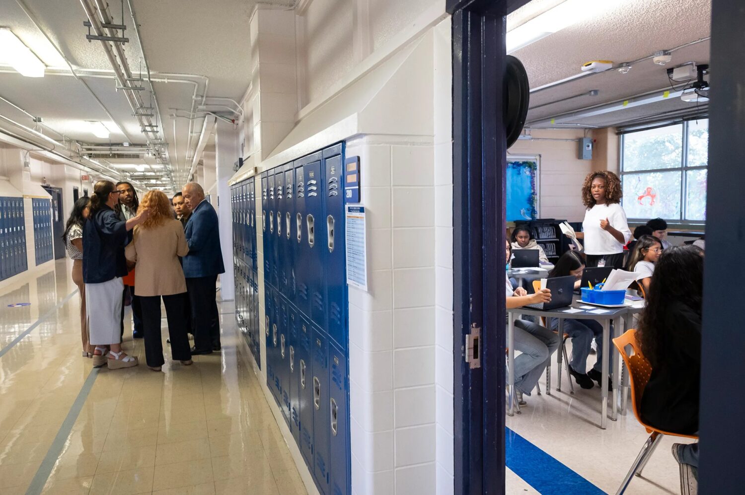 State-appointed HISD Superintendent Mike Miles huddles with Fonville Middle School administrators after observing seventh grade teacher Ashlie Flores teach her students on Wednesday, Aug. 26, 2026. Texas’ top officials want to use Miles’ school reform effort as a blueprint for Texas public schools.
