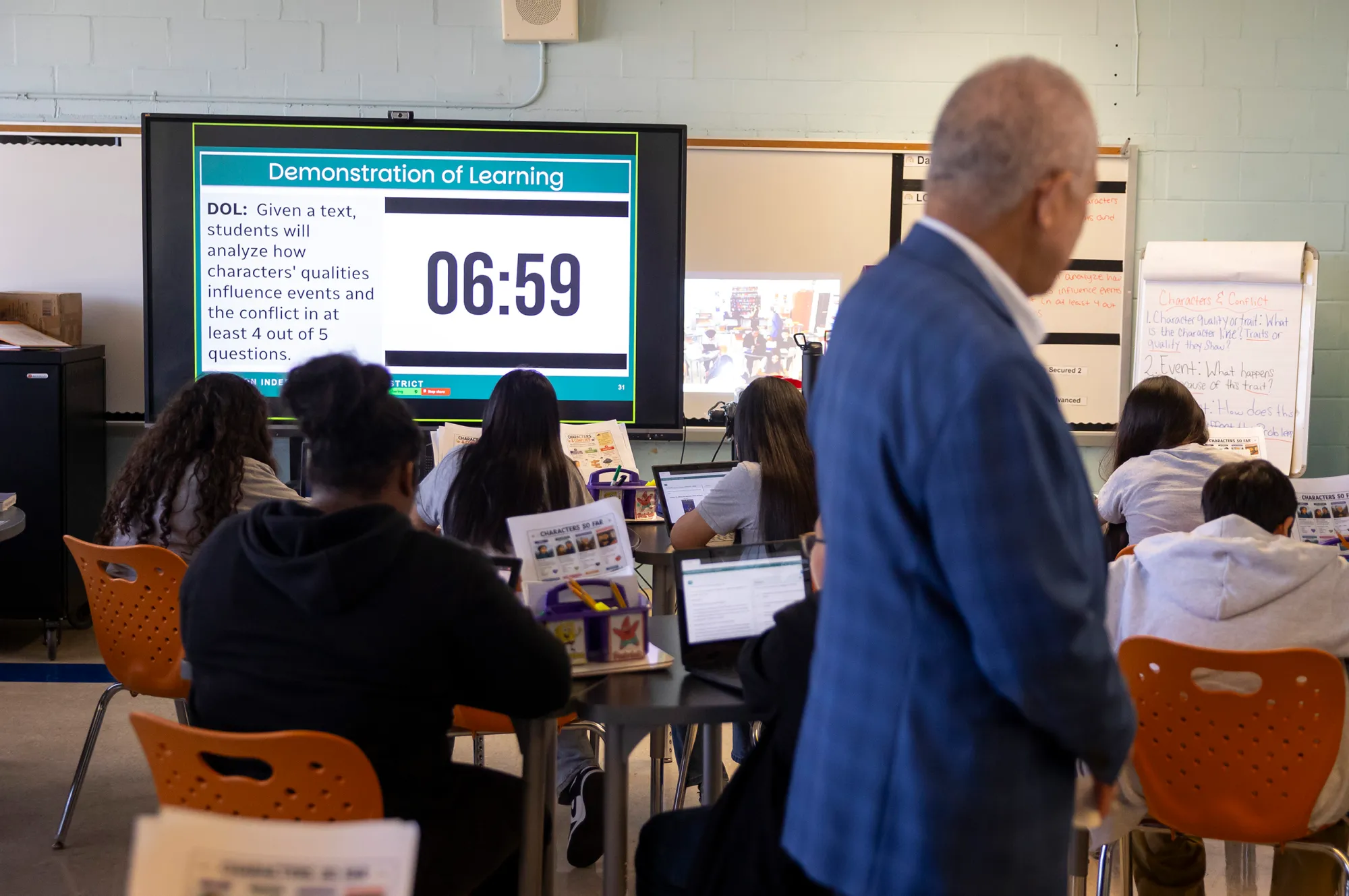 Miles observes a timed Demonstration of Learning, or DOL, where students are immediately tested and graded for a concept they just learned. Annie Mulligan for The Texas Tribune