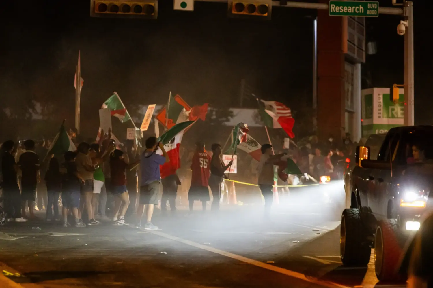 Protesters block part of Research Boulevard under U.S. 183 after an ICE officer shot and wounded 28-year-old Wilber Rafael Garces Perez on Sunday, Sept. 20, 2026, in North Austin.