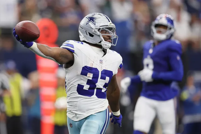 ARLINGTON, TEXAS - SEPTEMBER 14: Javonte Williams #33 of the Dallas Cowboys runs for a touchdown during the third quarter of the game against the New York Giants at AT & T Stadium on September 14, 2025 in Arlington, Texas. (Photo by Sam Hodde/Getty Images)