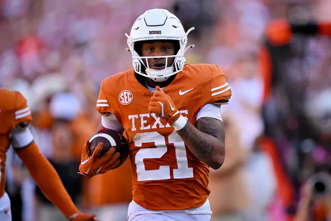 Oct 11, 2025; Dallas, Texas, USA; Texas Longhorns wide receiver Ryan Niblett (21) returns a punt for touchdown against the Oklahoma Sooners during the second half at the Cotton Bowl. Mandatory Credit: Jerome Miron-Imagn Images