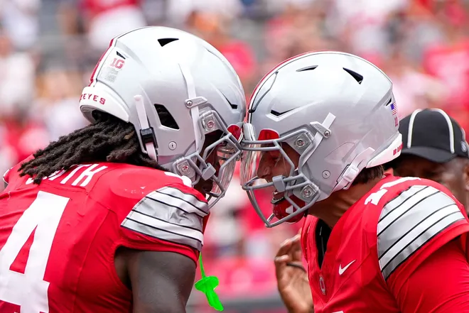 Ohio State Buckeyes wide receiver Jeremiah Smith (4) celebrates with quarterback Julian Sayin (10) after Smith scored a touchdown in the first half of the NCAA football game at Ohio Stadium on Sept. 5, 2026 in Columbus, Ohio.