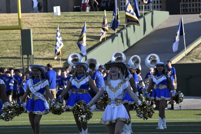 Legacy cheerleaders prepare for the team's runout before a homecoming game between the Leopards and Lubbock Monterey on Friday, Sept. 11, 2026.