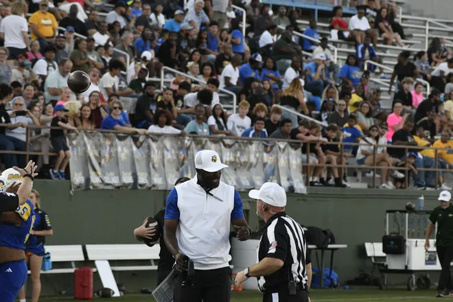 Legacy football head coach Greg Davis talks to a referee during the Leopards' homecoming game against Lubbock Monterey on Friday, Sept. 11, 2026.