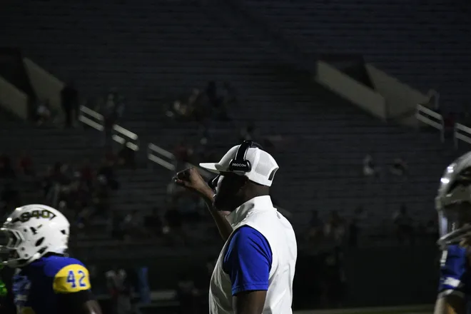 Leopards' head coach Greg Davis addresses his team in a timeout during Legacy football's 42-14 homecoming win over Lubbock Monterey on Friday, Sept. 11, 2026.