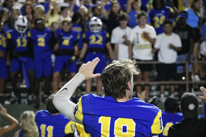 Junior quarterback Knox Hodges celebrates with the student section after Legacy football's 42-14 homecoming win over Lubbock Monterey on Friday, Sept. 11, 2026.