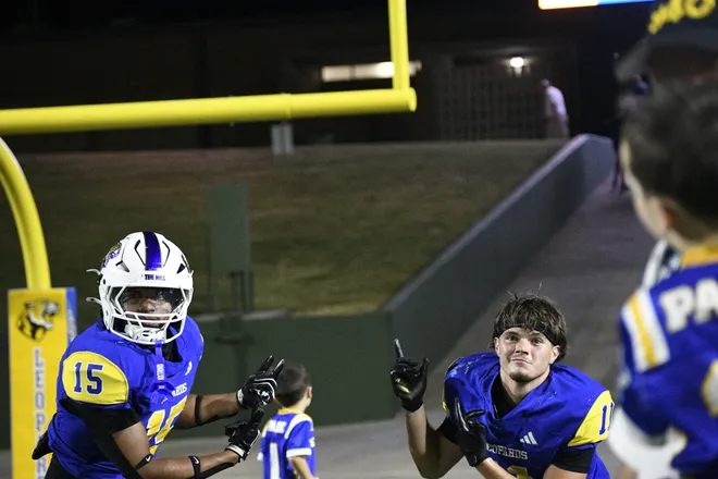Leopards' Emmanual Cruz-Reyes and Easton Drulinger point at the scoreboard after Legacy football's 42-14 homecoming win over Lubbock Monterey on Friday, Sept. 11, 2026.