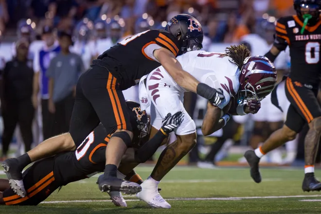 Texas Southern’s Jaquan McGee is tackled by UTEP defenders during a football game Saturday, Sept. 12, 2026, at Sun Bowl Stadium in El Paso, Texas.