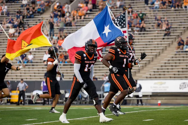 UTEP football players take the field for the football home opener against Texas Southern on Saturday, Sept. 12, 2026, at Sun Bowl Stadium in El Paso, Texas.