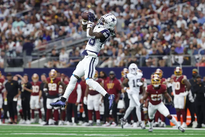 Sep 20, 2026; Arlington, Texas, USA; Dallas Cowboys wide receiver CeeDee Lamb (88) leaps to catch a pass against the Washington Commanders during the first quarter at AT & T Stadium. Mandatory Credit: Kevin Jairaj-Imagn Images