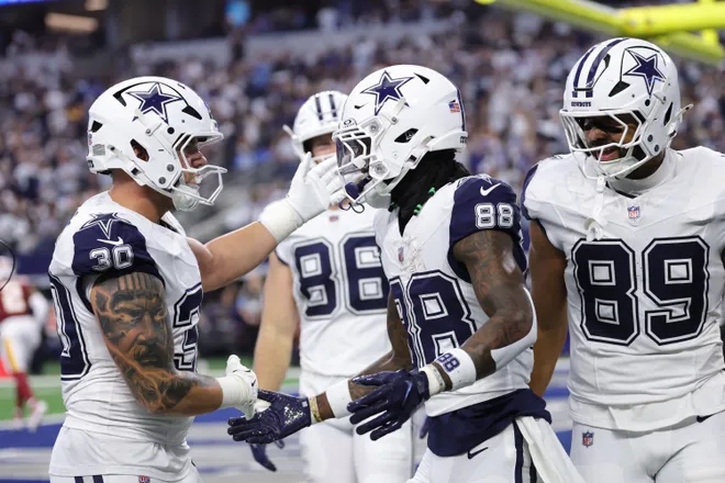 Sep 20, 2026; Arlington, Texas, USA; Dallas Cowboys wide receiver CeeDee Lamb (88) celebrates with tight end Brevyn Spann-Ford (89) and fullback Hunter Luepke (30) after catching a three-yard touchdown pass thrown by quarterback Dak Prescott (not pictured) against the Washington Commanders during the first quarter at AT & T Stadium. Mandatory Credit: Kevin Jairaj-Imagn Images