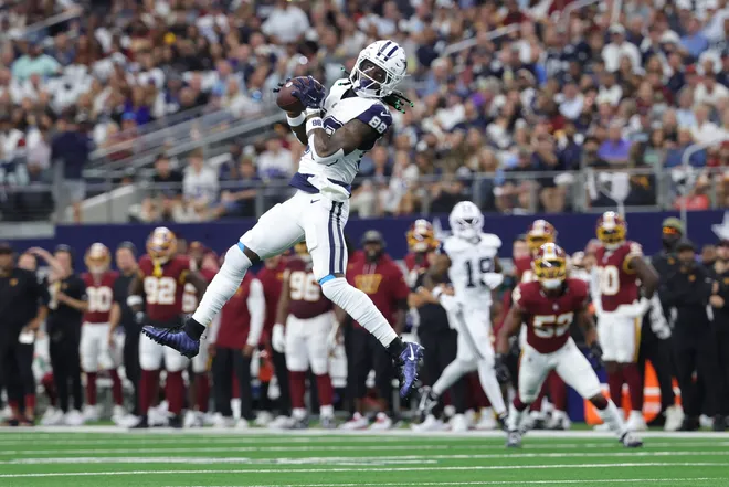 Sep 20, 2026; Arlington, Texas, USA; Dallas Cowboys wide receiver CeeDee Lamb (88) leaps to catch a pass against the Washington Commanders during the first quarter at AT & T Stadium. Mandatory Credit: Kevin Jairaj-Imagn Images