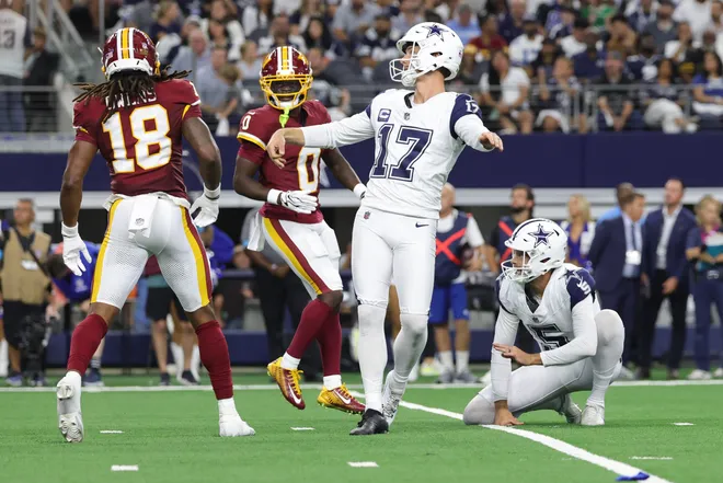 Sep 20, 2026; Arlington, Texas, USA; Dallas Cowboys placekicker Brandon Aubrey (17) watches the ball after kicking a twenty-five yard field goal held by punter Bryan Anger (5) against the Washington Commanders during the first half at AT & T Stadium. Mandatory Credit: Kevin Jairaj-Imagn Images