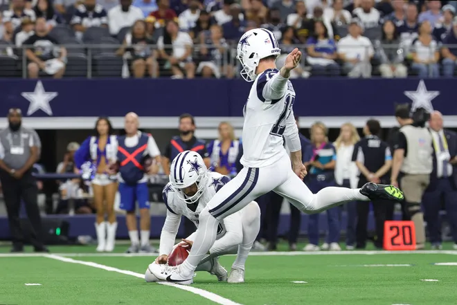 Sep 20, 2026; Arlington, Texas, USA; Dallas Cowboys placekicker Brandon Aubrey (17) kicks a twenty-five yard field goal held by punter Bryan Anger (5) against the Washington Commanders during the first half at AT & T Stadium. Mandatory Credit: Kevin Jairaj-Imagn Images