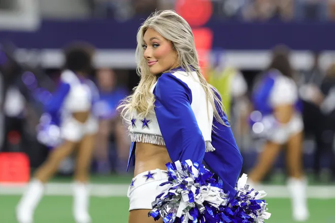 Sep 20, 2026; Arlington, Texas, USA; A Dallas Cowboys Cheerleader performs during a timeout in the first half against the Washington Commanders at AT & T Stadium. Mandatory Credit: Kevin Jairaj-Imagn Images