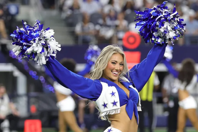 Sep 20, 2026; Arlington, Texas, USA; A Dallas Cowboys Cheerleader performs during a timeout in the first half against the Washington Commanders at AT & T Stadium. Mandatory Credit: Kevin Jairaj-Imagn Images