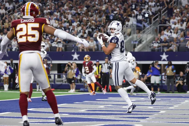 Sep 20, 2026; Arlington, Texas, USA; Dallas Cowboys tight end Jake Ferguson (87) catches a ten-yard touchdown pass thrown by quarterback Dak Prescott (not pictured) against the Washington Commanders during the first half at AT & T Stadium. Mandatory Credit: Kevin Jairaj-Imagn Images