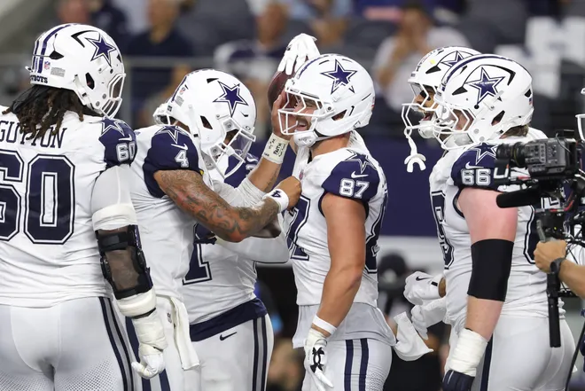 Sep 20, 2026; Arlington, Texas, USA; Dallas Cowboys tight end Jake Ferguson (87) celebrates with teammates after scoring a touchdown against the Washington Commanders during the first half at AT & T Stadium. Mandatory Credit: Kevin Jairaj-Imagn Images