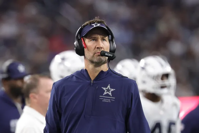 Sep 20, 2026; Arlington, Texas, USA; Dallas Cowboys head coach Brian Schottenheimer watches the video scoreboard during a stoppage of play against the Washington Commanders in the second half at AT & T Stadium. Mandatory Credit: Kevin Jairaj-Imagn Images