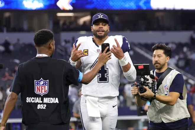 Sep 20, 2026; Arlington, Texas, USA; Dallas Cowboys quarterback Dak Prescott (4) jogs off the field and reacts for an NFL social media creator after a game against the Washington Commanders at AT & T Stadium. Mandatory Credit: Kevin Jairaj-Imagn Images
