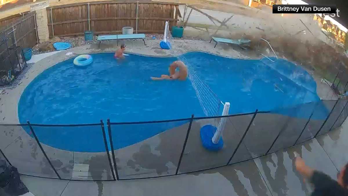 Video shows car crash through fence, narrowly missing children in pool